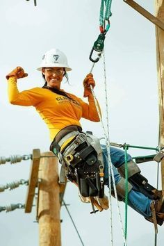 a man in safety gear on a rope course