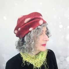 Introducing the whimsical Felted Amanita Mushroom Hat, a truly enchanting accessory that adds a touch of magic to your wardrobe. This hat is handcrafted with meticulous attention to detail, capturing the essence of the iconic red Amanita mushroom in a delightful and whimsical design. Wear this hat and let your imagination run wild as you embody the whimsy and charm of these fantastical fungi. COLOUR: • This felted hat is a glowing red with creamy white spots. The innermost layer of wool is a gre Red Hat As A Gift, Red Hat As A Gift, One Size Fits All, Handmade Red Mini Hat With Short Brim, Whimsical Red Brimmed Hat, Artisan Red Hat With Short Brim, Whimsical Red Winter Hat, Whimsical Red Hat As Gift, Whimsical Red Hat With Curved Brim, Red Bohemian Hat As A Gift