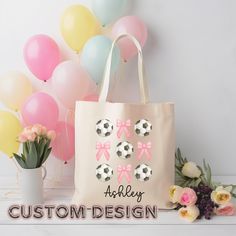 Combine your love for soccer and style with our Custom Soccer and Bows Canvas Tote Bag! This trendy and practical bag is perfect for carrying all your essentials, whether you're heading to practice, school, or a day out. Personalize it with your name to make it uniquely yours or gift it to a soccer-loving friend! Product Details:  * Durable canvas material * Personalized with name  * Spacious interior * Measures - 15" x 16"- perfect for everyday wear * 100% cotton canvas bag  * While the canvas material will show off your designs in great colors, it's durable and will last for years * The bag features 20" handles (made from the same canvas), making it easy to carry  *Do not iron directly over the printed area - print may stick to the iron.; Spot clean; Do not bleach; Line dry. Custom-Order Customizable White Bags For Sports Events, White Tote Bags For Sports Events, White Tote Bag For Sports Events, White Sporty Bag As Gift, Sporty White Bag As Gift, Sporty White Bag Suitable For Gifts, Customizable White Bag For Birthday, Coquette Tote Bag, Bow Tote Bag