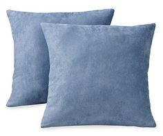 two blue pillows on white background