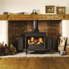 a wood burning stove sitting inside of a living room