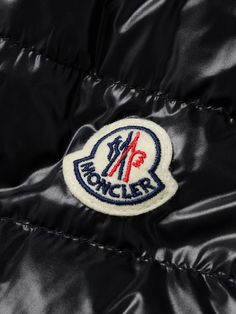 Founded in 1952, Moncler started out making heavy-duty jackets for labourers in harsh climates, and today, it continues to make functional outerwear for explorers. This 'Levanter' hooded jacket is made from water-repellent shell and padded with down for warmth. Note how the quilting is stitched in curves, giving it a subtle point of difference. Winter Workwear Outerwear With Logo Patch, Black Outerwear With Logo Patch For Work, Winter Outdoor Outerwear With Logo Patch, Ysl Lip, Cult Gaia Bag, Tods Bag, Tom Ford Bag, Men Dior, Moncler Women