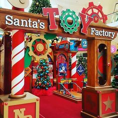 the entrance to santa's factory is decorated with candy canes and christmas decorations