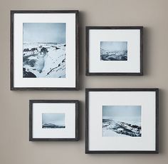 four black and white pictures hanging on the wall