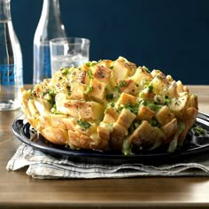 there is a pie on the table with water bottles