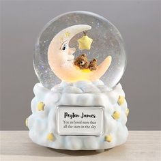 a snow globe with a teddy bear on the moon and poem written in it that says,'you are loved more than all the stars on the sky '