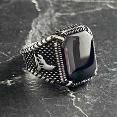 Handmade Black Onyx Stone Ring , Natural Onyx Gemstone Ring , Wolf Figured Ring , Special Flashy Ring , Engraved Silver Ring , Gift For Him , Same Day For Shipping ✧ Product Details * Handmade İtem * Gender : Male / Female * Material : 925K Sterling Silver * Ring Weight : 9 Grams * Gemstone Type : Black Onyx ✔ Usage Details * Silver jewelry is very sensitive to chemicals. It is recommended to keep away from chemical substances such as cream, bleach, deodorant, detergent. * Silver jewelry can als Classic Black Crystal Ring For Gift, Handmade Black Gothic Rings, Handmade Gothic Black Rings, Vintage Adjustable Black Signet Ring, Vintage Black Adjustable Signet Ring, Black Jewelry With Stone Setting For Gift, Gothic Black Ring With Polished Finish, Black Onyx Gothic Rings, Black Gothic Ring With Polished Finish