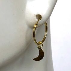 A PAIR of sterling silver hoops dipped in gold. Comes with a tiny crescent moon charm. The charm is multipurpose and can be used with a neck or bracelet chain too. Dimension: Hoop- 12x1 mm Charm- 4 x 9mm Drop length- 18 mm This piece is made of 925 hypoallergenic sterling silver. All my pieces are sent in a gift box. I can include a personal message from you if needed. You are welcome to contact me at... bhavnakwintra1956@gmail.com More hoops: https://www.etsy.com/your/shops/TheSilverGame/tools/ Gold Half Moon Hoop Earrings With Moon Charm, Nickel-free Crescent Hoop Earrings For Everyday, Adjustable Nickel-free Celestial Hoop Earrings, Gold Huggie Earrings With Moon Charm, Everyday Crescent Hoop Earrings Nickel Free, Moon Charm Hoop Earrings In Celestial Style, Adjustable Moon Charm Hoop Earrings, Nickel Free Moon Shaped Hoop Earrings Gift, Adjustable Hoop Earrings With Moon Charm