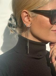 Introducing our exquisite Long Silver Earrings - a fine masterpiece exclusively crafted for you. Expertly handcrafted from high-quality stainless steel, this unique pair features three delicate minimal chains of varying lengths gracefully embraced by a seamless push back closure. The pièce de résistance lies in the stunning silver bar adorning the front, lending an extraordinary charm to the final creation. Lightweight and remarkably comfortable, these earrings epitomize elegance and are availab Modern White Gold Clip-on Earrings As Gift, Elegant Silver Ear Climbers As Gift, Elegant Silver Ear Climbers For Gifts, Trendy Wrap Drop Earrings As Gift, Trendy Wrap Drop Earrings For Gifts, Silver Metal Linear Earrings For Evening, Elegant Metal Wrap Earrings For Gift, Pierced Drop Wrap Earrings For Party, Elegant Metal Ear Climbers As A Gift