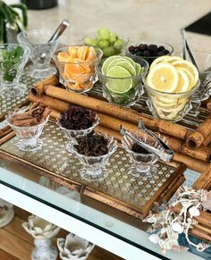 an assortment of fruits and spices on a tray