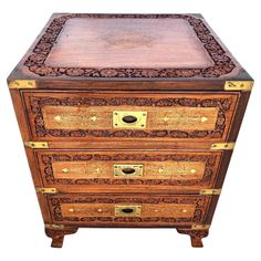 an ornate wooden chest with two drawers