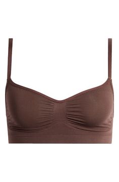 Enjoy comfortable support and shaping with this lightweight bralette from Kim Kardashian's SKIMS. This second-skin style is an ideal choice for lounging, sleeping or everyday wear. Unlined 41% recycled nylon, 41% nylon, 18% elastane, Machine wash, tumble dry Imported Seamless Cropped Bra, Cropped Seamless Stretch Bra, Seamless Cropped Bra For Loungewear, Comfortable Fitted Seamless Bra, Seamless Medium Support No-show Bra, Cropped Seamless Bra For Loungewear, Seamless Cropped Sports Bra In Elastane, Fitted Seamless Brown Bra, Full Coverage Stretch Bra For Loungewear