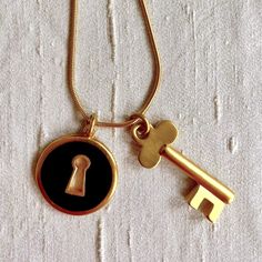 Vintage, Signed Anne Klein Modernist Skeleton Key And Key Hole Charm Necklace On Gold Plated Snake Chain. This Black Enamel And Gold Plated Key Charm Was An Anne Klein Trademark Piece, Originally Sold As A Brooch; This Versatile Necklace Is A Rare Find And Was Limited Addition. Chain Is 30” Long. The Fine Craftsmanship Of The Superior Necklace Is Of A Standard No Longer Available In Costume Jewelry Today. Necklace Is In Excellent Condition, Like Brand New. *Remember To “Bundle” And Save On Shipp Key And Keyhole, Skeleton Key, Key Necklace, Key Hole, Black Enamel, Snake Chain, Anne Klein, Long Necklace, Costume Jewelry