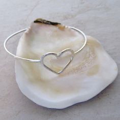 "Sterling Silver Heart Bangle~ Beautiful sterling silver heart bangle, custom made for you! Hammered and polished for that extra sparkle! Looks great worn with one or more! Perfect gift for Valentine's Day, Anniversary or Bridesmaid gift. Made with 14 gauge sterling silver wire Please view the last picture on this listing that shows how to measure for your correct size as there will be a charge for size exchange! For correct size measure the circumference of your hand with a tape measure around Silver Heart Bracelets For Wedding, Silver Heart Bracelet For Wedding On Valentine's Day, Heart Charm Bangle Bracelet For Wedding, Wedding Heart Charm Bangle Bracelets, Sterling Silver Heart Bangle For Anniversary, Heart-shaped Bangle For Valentine's Day, Heart-shaped Sterling Silver Wedding Bracelets, Wedding Bangle Bracelet With Heart Charm, Silver Open Heart Bracelet For Wedding