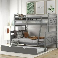 a bunk bed with a futon underneath it in a room that has hardwood floors and white walls