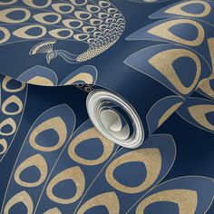 a blue and gold wallpaper with an abstract peacock design on the back, along with white circles