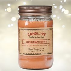 a glass jar filled with christmas spice