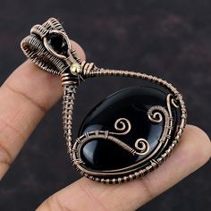 Artisan Black Cabochon Jewelry, Nature-inspired Black Jewelry Gift, Black Agate Wire Wrapped Jewelry, Nature-inspired Black Jewelry With Natural Stones, Artisan Wire Wrapped Black Jewelry, Artisan Black Wire Wrapped Jewelry, Handmade Black Nature-inspired Jewelry, Handmade Nature-inspired Black Jewelry, Black Onyx Pendant