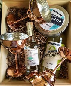 an open box with some bottles and spoons in it