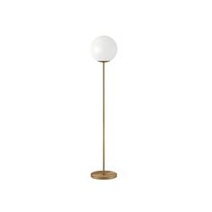 a floor lamp with a white glass ball on the top and a gold metal base