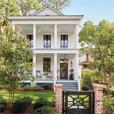 a white two story house with black shutters