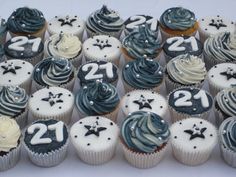 cupcakes with blue and white frosting are arranged in the shape of numbers