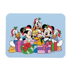 a group of mickey mouses with christmas presents in front of them on a blue background