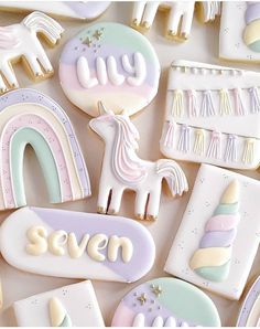 some cookies that are shaped like unicorns and rainbows