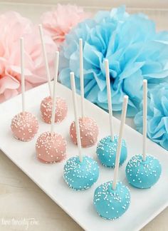 blue and pink cake pops on a white plate