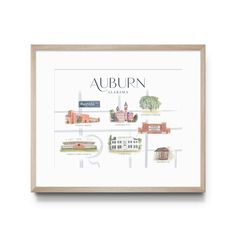 the auburn campus map is shown in a wooden frame on a white wall above it are trees and buildings