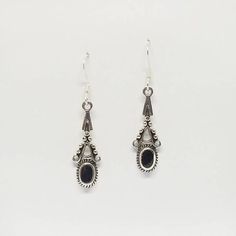 These ornate Black Onyx drop earrings were created in solid Sterling Silver and designed with an intricate pattern that cascades downward to encircle the oval Black Onyx cabochons. The stones are rounded giving nice dimension to the earrings. These are my go to earrings, I love that they are not heavy and that Black Onyx goes with everything whether I am wearing jeans or a little black dress. They measure  38mm or 1.5 inches.Black Onyx is known as a protection stone that enhances intuition.~You Vintage Oxidized Black Jewelry, Black Vintage Oxidized Jewelry, Black Gothic Jewelry With Oxidized Finish, Black Elegant Chandelier Earrings, Nickel Free, Vintage Black Dangle Jewelry, Silver Teardrop Jewelry With Black Enamel, Black Enamel Dangle Jewelry, Vintage Black Jewelry With Matching Earrings, Black Metal Earrings With Oxidized Finish