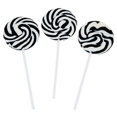 three lollipops with black and white designs on them