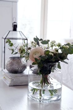 a vase filled with flowers sitting on top of a table