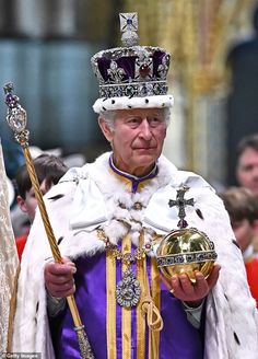 an older man wearing a crown and holding a golden object