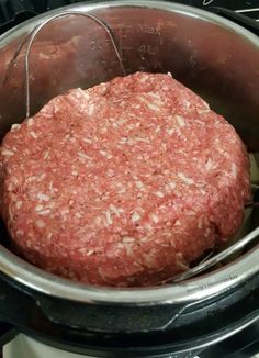 a hamburger is cooking in an electric pressure cooker