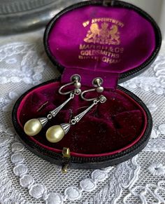 Featuring a beautiful antique pair of Edwardian Belle Époque 1910s 830  silver Austra, Germany  screw back drop earrings adorned with luminous glass Majorca peals accented brilliant sparkling closed back Marcasite crystals.  Earrings are in excellent antique condition with functional backings, minimal wear with all stones intact and accounted for.  Measuring approximately 1.5 inches long at 3.15  grams respectively and are stamped 830 on the clasps .  These are absolutely gorgeous, ready to wear Crystals Earrings, Victorian Aesthetic, Art Deco 1920s, Back Drop, Majorca, Sterling Silver Filigree, Conch Shell, Unique Antiques, Garnet Gemstone