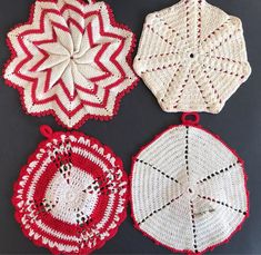 four crocheted doily are arranged on a black surface, one is red and the other is white