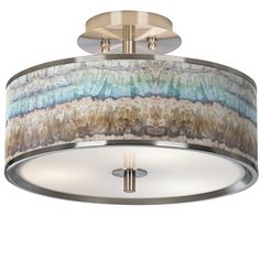 a semi - flush ceiling light with an abstract design on the drum and two lights