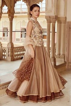 Brown scallop edged short kurta with pearls, beads, stones, sequins and thread embroidered floral motifs. Paired with solid scallop edged lehenga and ruffle embroidered dupatta. - Aza Fashions Diwali Saree Dress With Pearl Embroidery, V-neck Wedding Dress For Diwali, Pearl Embroidered Designer Dress For Diwali, Designer Pearl Embroidery Dress For Diwali, Bollywood Style Dress With Pearl Embroidery For Diwali, Diwali Designer Dresses With Pearl Embroidery, Pearl Embroidered Dress For Wedding And Diwali, Elegant Dresses With Gota Work For Navratri, Elegant Gota Work Dresses For Navratri