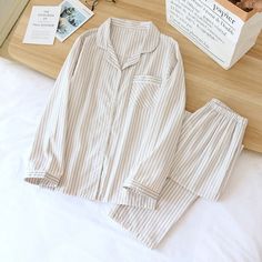 The Striped Unisex 2 Piece Pajama Set Cotton Sleepwear is a unisex set that will become your new favorite. Look cute and put together every night while never compromising comfort. We are passionate about fabric and textile materials and have thus created the best, most comfortable yet practical line of pajamas. This loungewear is all you need to help relax at home. They are soft and easy to touch which projects versatility and effortless grace in every step you take. Made to make you feel good, Pajama Set Cotton, Lounging Outfit, Striped Pajamas, New Years Wedding, Striped Two Piece, Comfy Sets, Cotton Sleepwear, Striped Pyjamas, Casual Evening