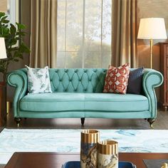 a living room scene with focus on the couch and coffee table in the foreground