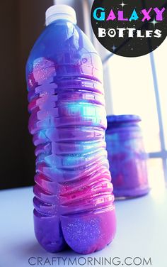 there is a plastic bottle with purple and blue liquid on it