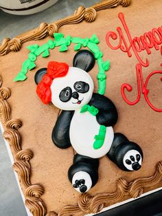 a birthday cake with a panda bear on it