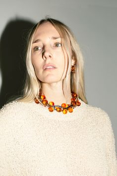 A chunky, linked statement necklace punctuated with amber colored beads. About 19" long including the clasps. Elegant Amber Jewelry With Large Beads, Orange Large Beaded Jewelry For Party, Elegant Baltic Amber Necklace In Orange, Elegant Orange Glass Jewelry, Elegant Orange Baltic Amber Necklace, Saturn Necklace, Amber Color, Amber, Statement Necklace