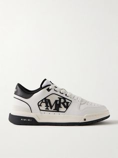 AMIRI upgrades traditional court sneakers with its signature iconography in this 'Classic Low' pair. Detailed with a staggered logo and signature star perforations, they have leather uppers, suede trims and stacked, two-tone rubber soles. Wear them with the label's jeans or track pants. White Classic Custom Sneakers With Logo, Classic Custom Sneakers With Logo On White Sole, Luxury High-top Custom Sneakers With Logo, Luxury Leather Custom Sneakers With Logo, Luxury High-top Sneakers With Embroidered Logo, Luxury Leather Custom Sneakers With Embroidered Logo, Luxury Leather Sneakers With Embroidered Logo, Luxury Streetwear Sneakers With Embroidered Logo, Luxury Custom Sneakers For Streetwear With Embroidered Logo