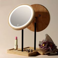 a wooden stand with a mirror and lipstick on it