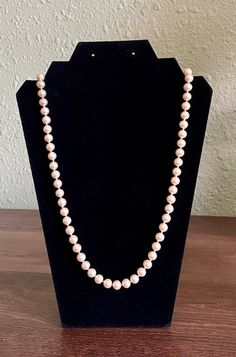 The vintage pearl necklace is absolutely lovely and in great condition. It screams class and elegance and would complement any attire. It has a rich, champagne color, and a silver clasp. Please note that my items are used, vintage, or antique and some will be in an age-related condition including marks, chips, crazing, scratches, dings, dents, etc. I do the best I can to describe them as I see them. Also, the color you see in the picture is as close as I can get to real life. Please remember that monitor and computer settings can make colors look brighter, duller, or completely different. Vintage Pearl Necklace With Pearl Charm For Formal Occasions, Classic Pearl Beaded Necklace For Formal Occasions, Formal Cream Single Strand Pearl Necklace, Formal Single Strand Cream Pearl Necklace, Formal Costume Pearl Necklace, Classic Formal Beaded Necklace With Pearl Charm, Vintage Cream Single Strand Pearl Necklace, Vintage Beaded Pearl Necklace For Formal Occasions, Vintage Pearl Necklaces For Formal Occasions