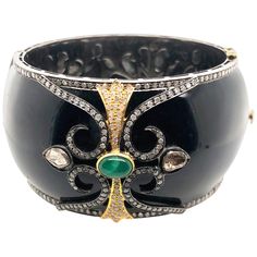 Designer black enamel bangle with diamond motif on top and around. This bangle is openable and has beautiful floral silver grill inside for smooth feel inside. Closure: Box Clasp 14k: 5.74gms Diamond: 5.1ct Silver: 92.4gm Emerald: 1.5ct Bangle With Diamonds, Bracelets Design, The Bangles, Vintage Bangles, Enamel Bangle, Bangle Designs, Silver Band Ring, 925 Silver Jewelry, Bangle Set