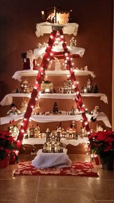 a christmas tree made out of shelves with lights