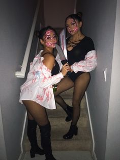 two women dressed up as zombies on the stairs